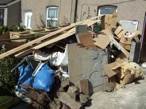 Before and after garage clearance in Bowes Park